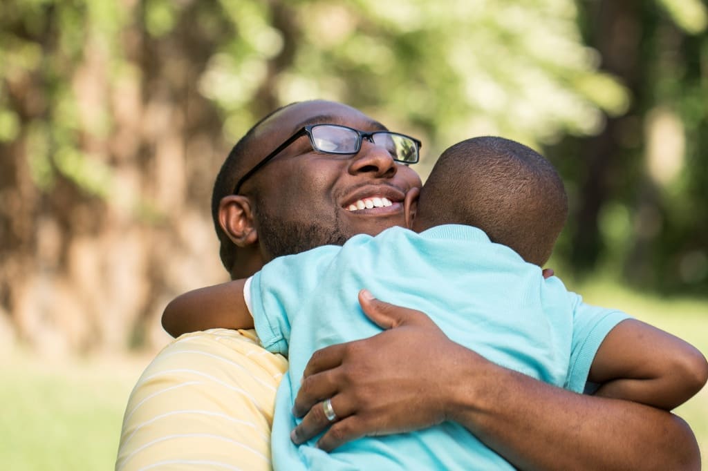 Son Smiling With His Dad