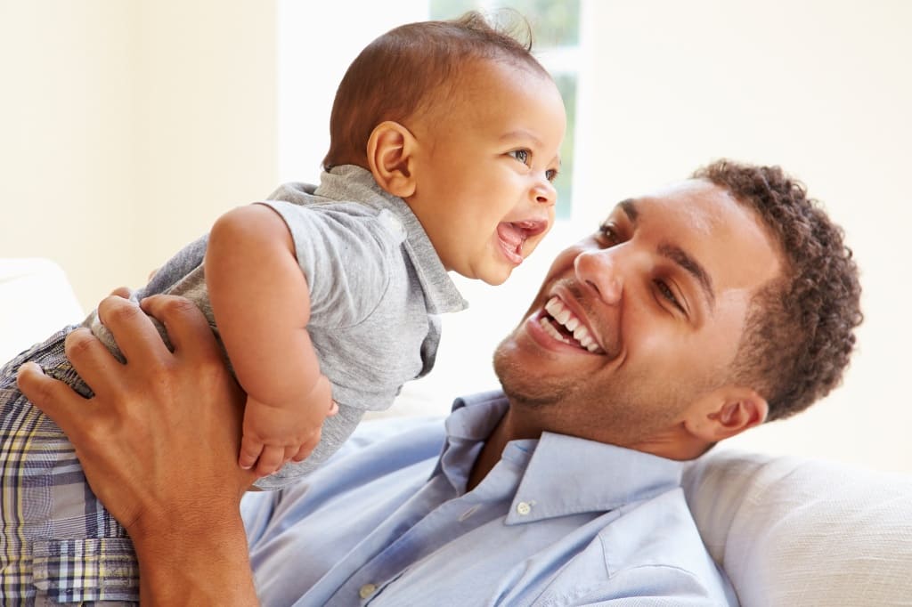 Father Smiling With His Child
